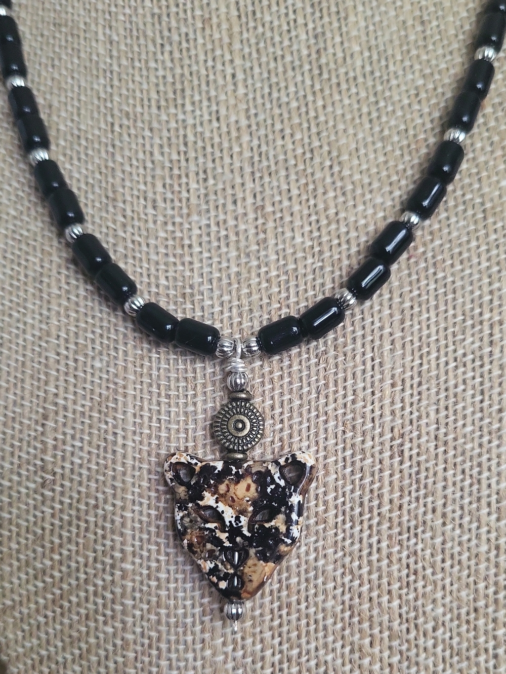 Handmade Black and Silver Beaded Necklace with Speckled Brown Leopard Pendant